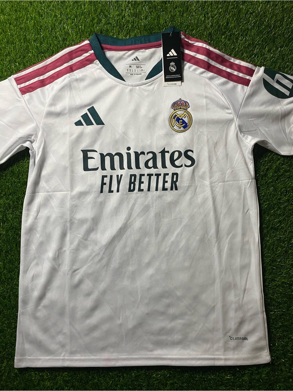 Real Madrid Home Jersey - White with Burgundy and Dark Green Accents